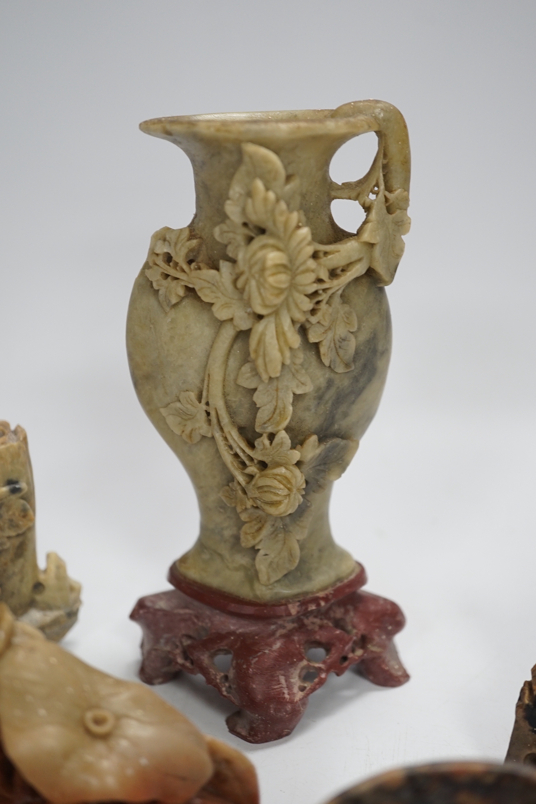 Eight early 20th century Chinese soapstone brushwashers, vases and carvings, largest 16cm high